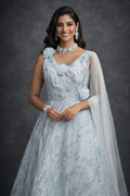UMA SUTRA Ice Blue Embellished Gown with Floral Appliqué & Sheer Drape